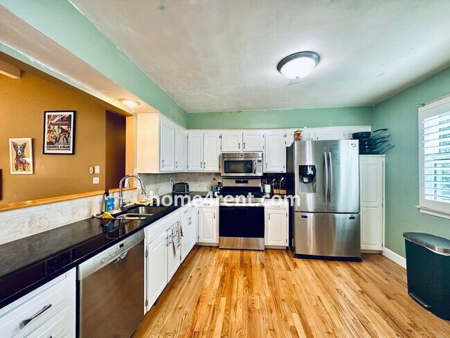 Building Photo - A Lovely, Four Bedroom Lenexa Home w/ Wood...