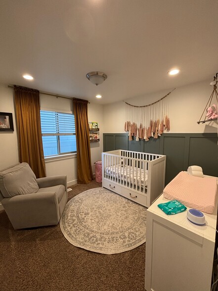 Main floor bedroom with closet (2 short hang and cubbies) - 2439 E Ox Yoke Dr