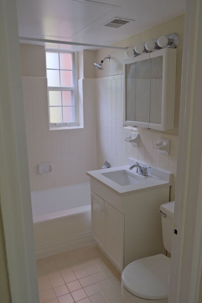 Building Photo - Beautiful corner unit in a secure, all-brick, pet-friendly building