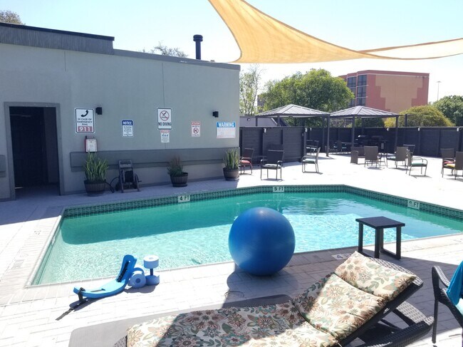Outdoor pool has plenty of seating. - 935 La Posada Dr