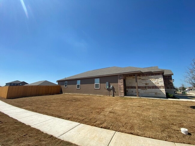 Building Photo - The newly built 4 bedroom and 2 bath home ...