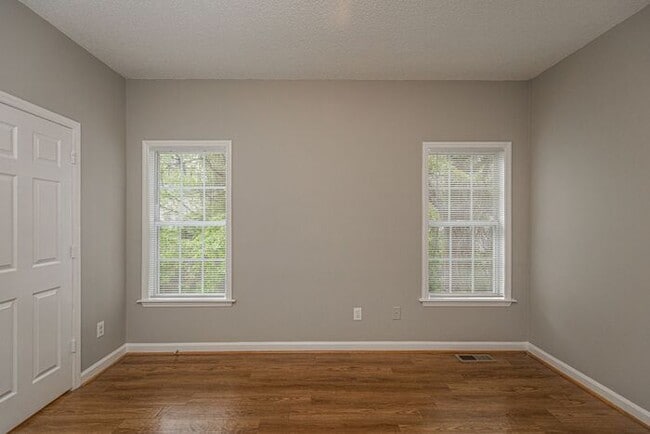 Building Photo - Like New Home off Freeman Mill. Just Painted, New Wood/Vinyl Flooring, Vaulted Ceilings, Front Po...