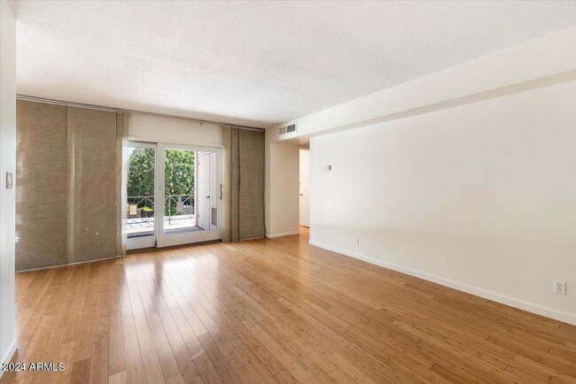 Bright Living Room viewed from Front Door - 6935 E 4th St