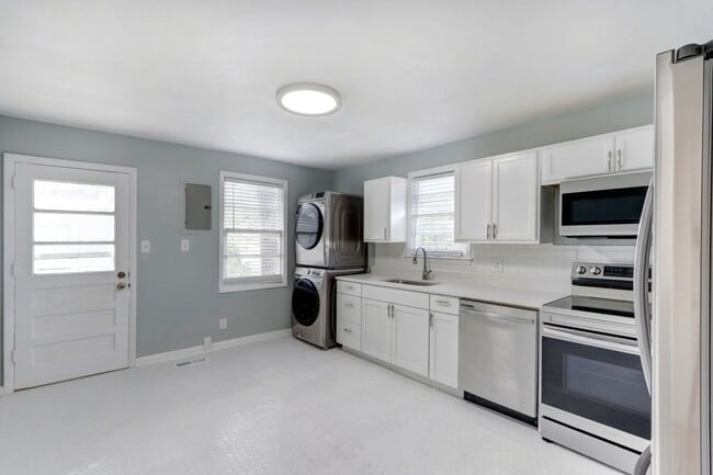 Building Photo - Renovated Three Bedroom House with large yard