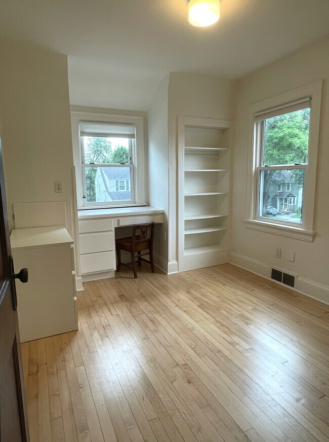 Second bedroom with built-in desk, shelves, and closet. Ideal office or guest space - 3209 Atwood Ave