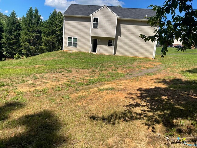 Building Photo - Available Now – Spacious 4BR Home on 1.5 Acres in Rural Hall!