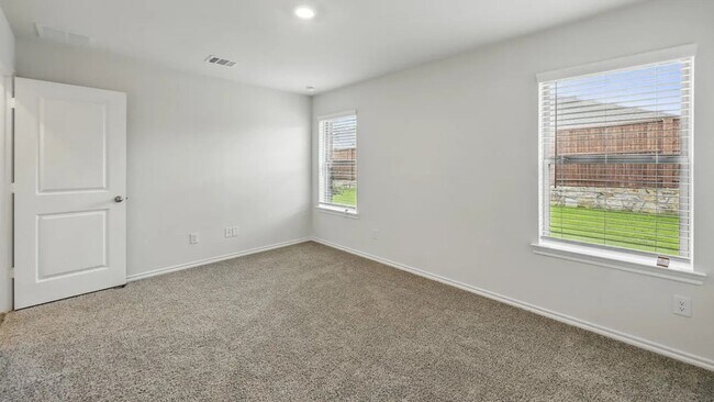 Building Photo - Beautiful new 4-bedroom, 2-bath home with an open floor plan, granite kitchen, two-car garage, an...