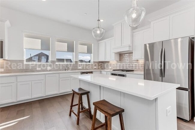 Building Photo - Live Elevated in the Heart of Viridian – S...