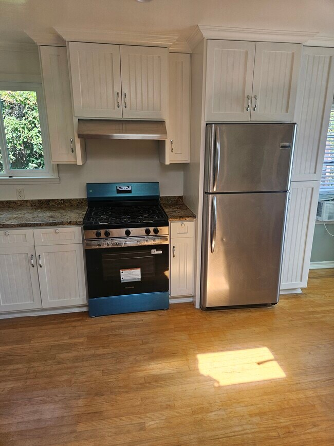 Kitchen with New gas stove - 838 Pacific St