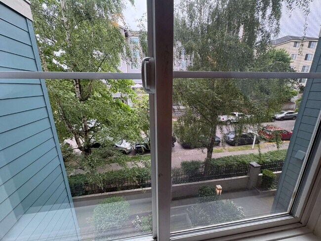 Building Photo - Bright, Modern 1BR Near Hospitals, SU & Transit in secure building with garage parking and a Walk...