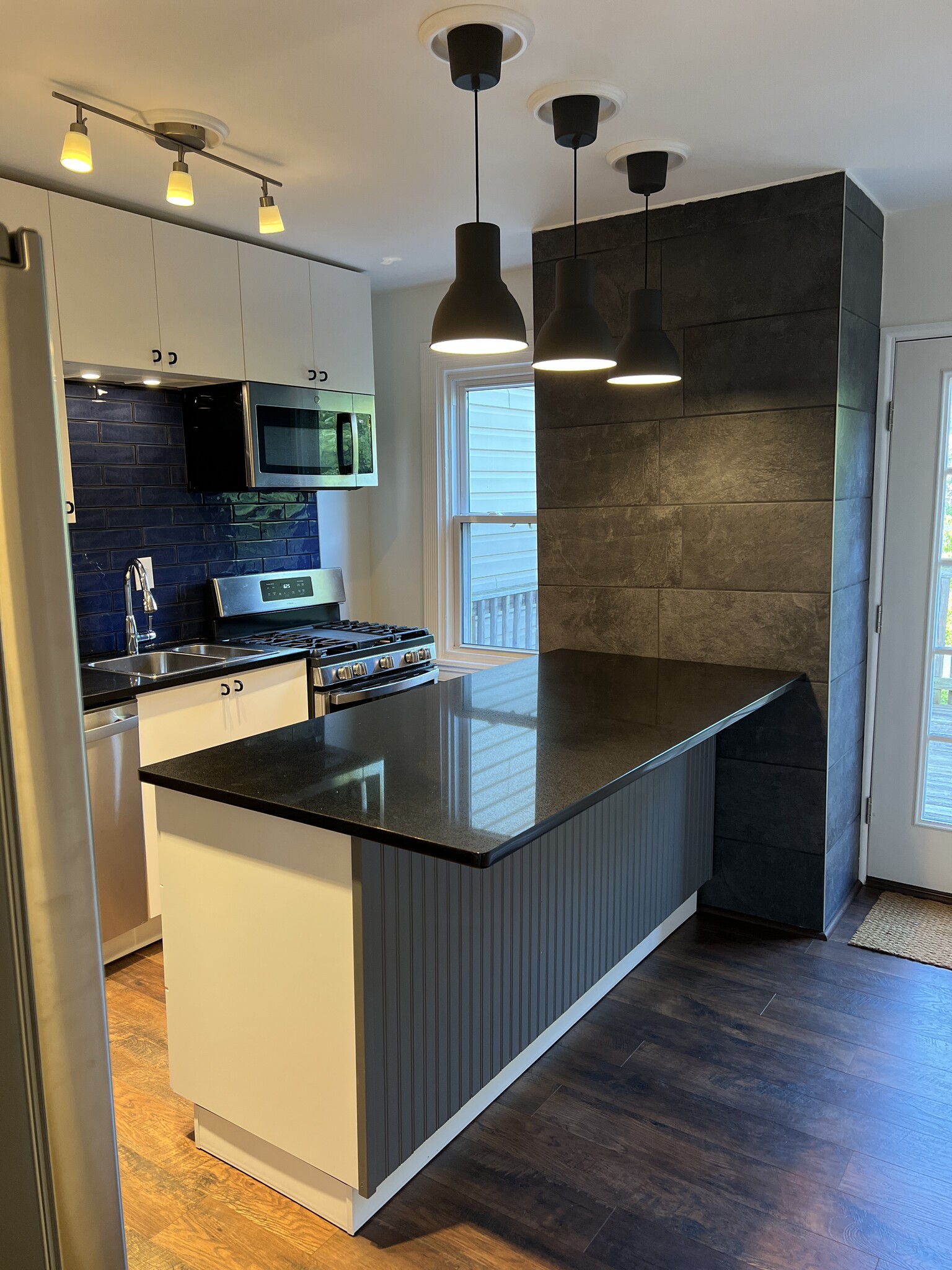 Eat-in kitchen with an island that seats three. - 126 Merion Ave