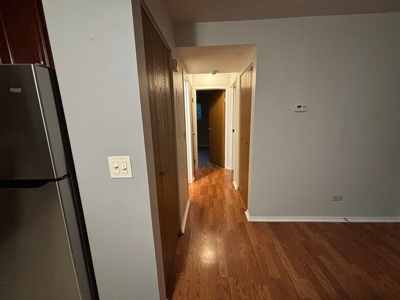 Hallway to bedrooms and bathrooms from living and kitchen area - 2256 Abbeywood Dr