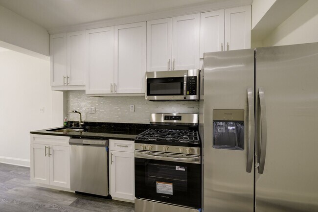 Building Photo - Charming & Renovated Petworth Rowhouse with Parking -  Available Now!