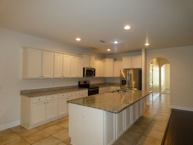 Building Photo - Spacious 5-Bedroom Home - Heart of Pace