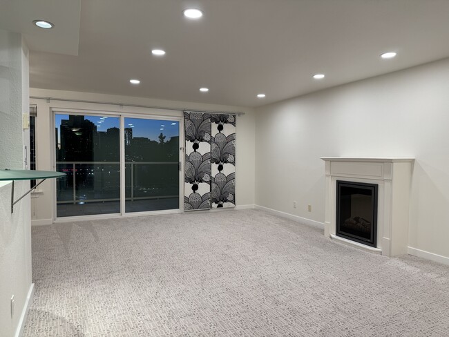 Living room with fireplace - 701 122nd Ave NE