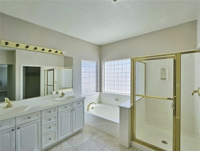 Building Photo - GATED SUMMERLIN HOME | 5 BEDROOM + DOWNSTAIRS DEN | 3-CAR GARAGE