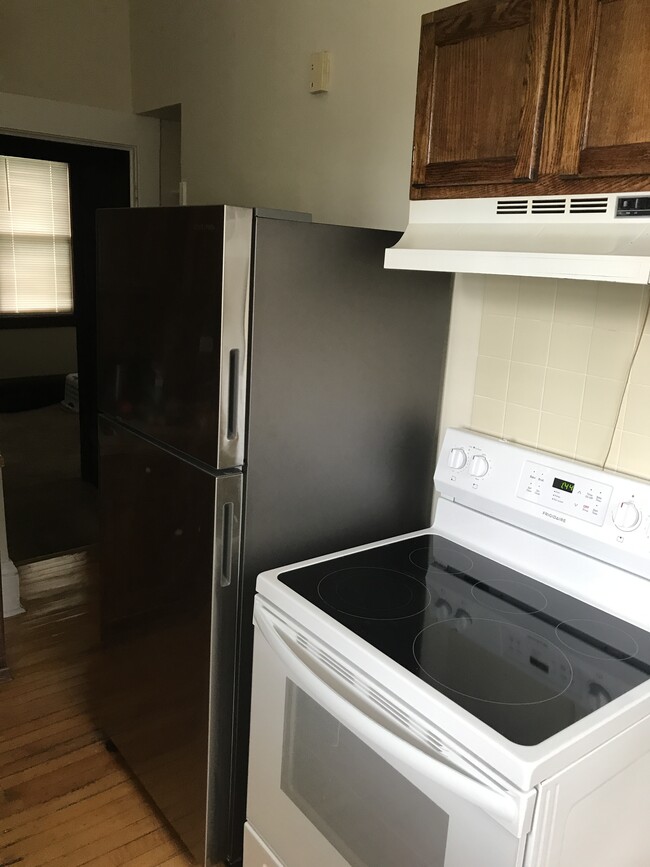 Stainless steel fridge and modern glass top stove - 1145 Jessie St