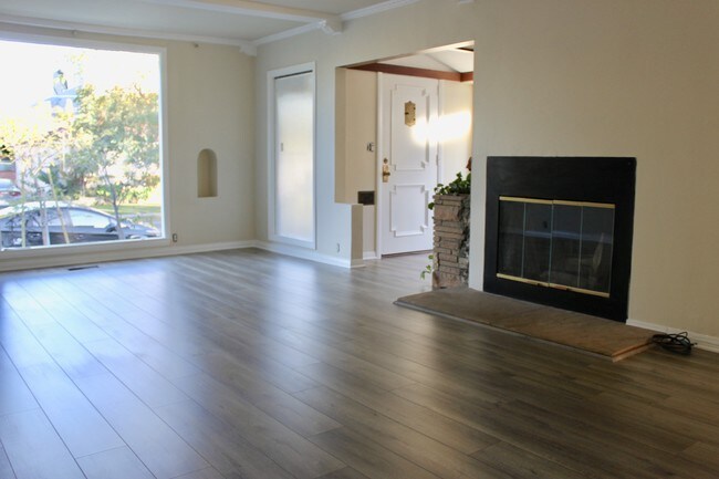 large living room with wood fire place - 3549 Schaefer St