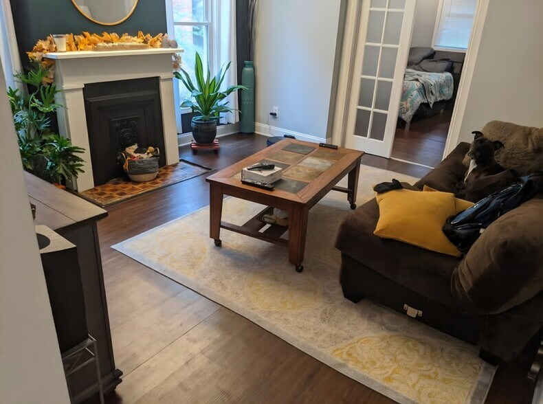 Living room entry. 2nd bedroom to right, 3rd bedroom ahead.. - 106 Atkinson St