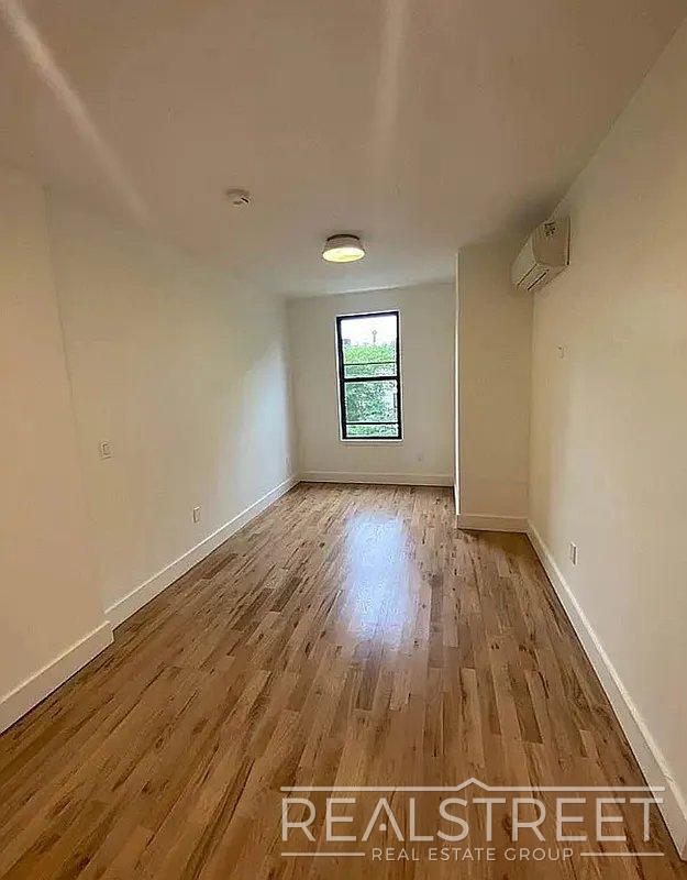 Building Photo - Bright & Renovated 2-Bedroom Apartment with Modern Amenities and Roof Access