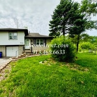 Building Photo - Olathe Duplex w/ Wood Floors, Finished Basement, and a Fenced Yard!