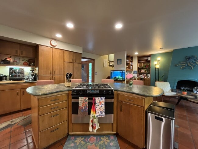 Building Photo - One-of-a-Kind Custom Home with Wall of Windows, Stone Fireplaces, Expansive Entertainment Space &...