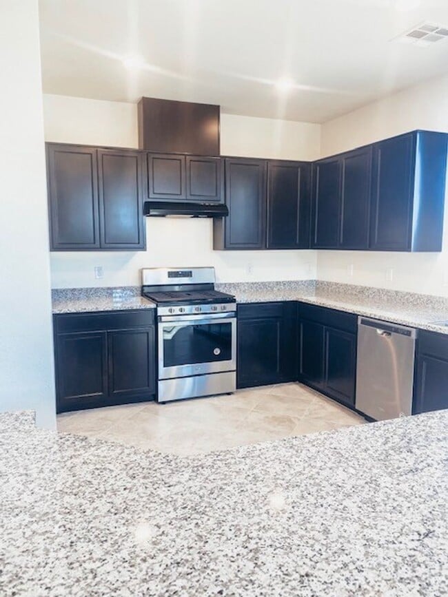 Building Photo - Beautiful Townhome in a Gated Community with 2-Car Garage!!