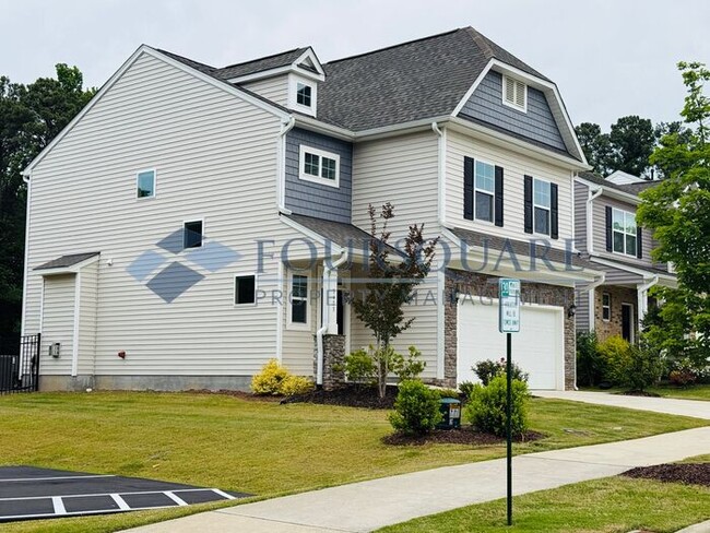Building Photo - End-Unit Townhome with Fenced Yard, Washer/Dryer included & 2-Car Garage – Comfortable & Convenie...
