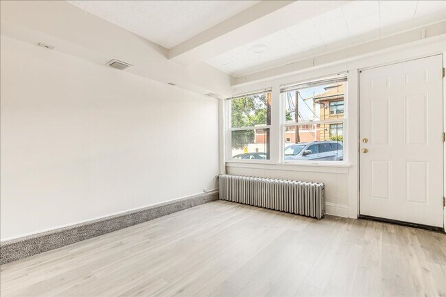 Building Photo - Spacious, Charming Victorian Style Tri-Ple...