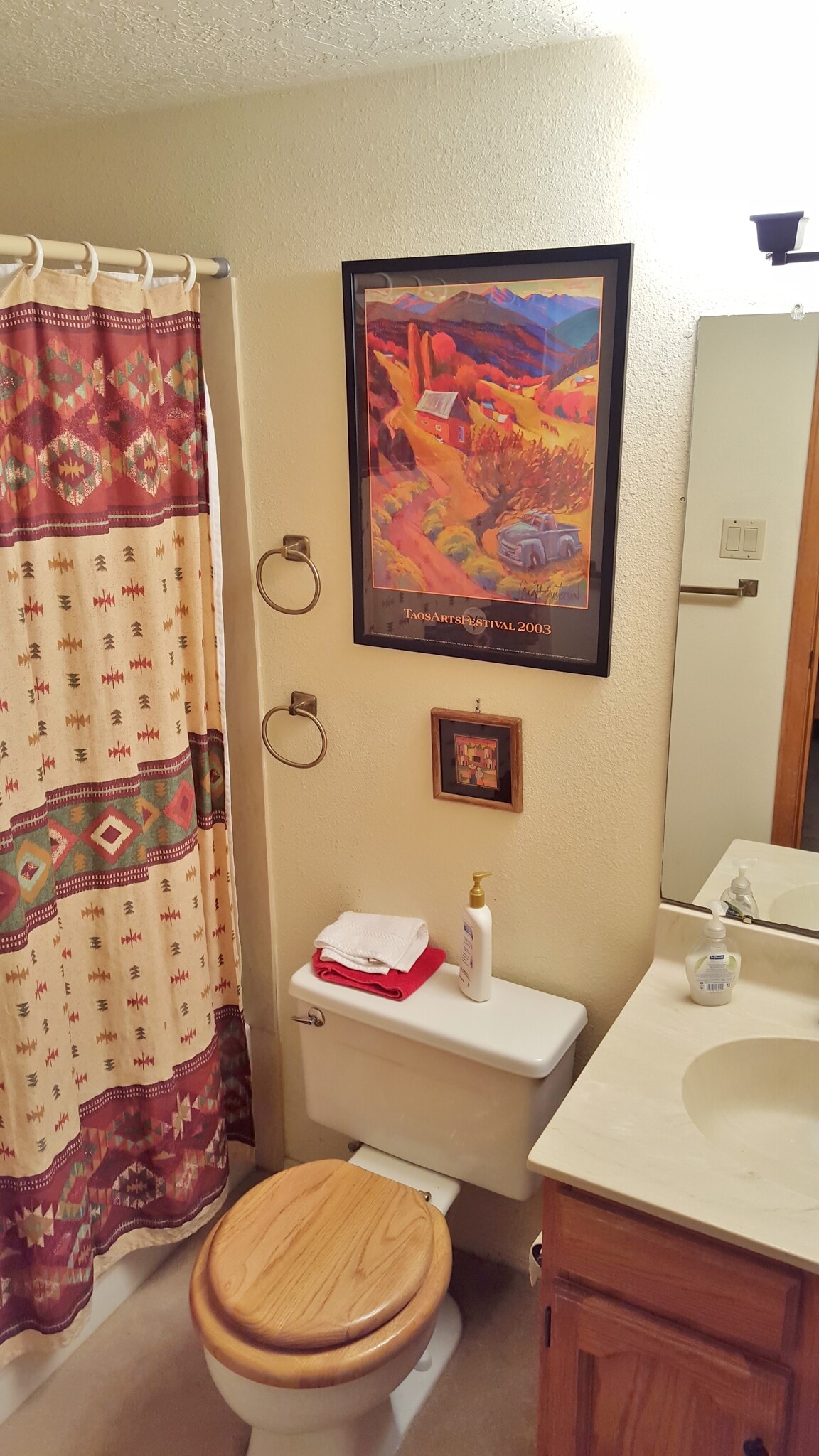 Here is the small downstairs bathroom with shower and tub. - 6436 Saint Josephs Ave NW
