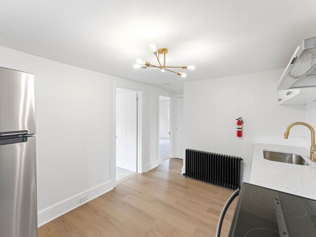 Building Photo - Renovated 3-Bedroom Apartment with Bonus Finished Attic & Spacious Shared Backyard