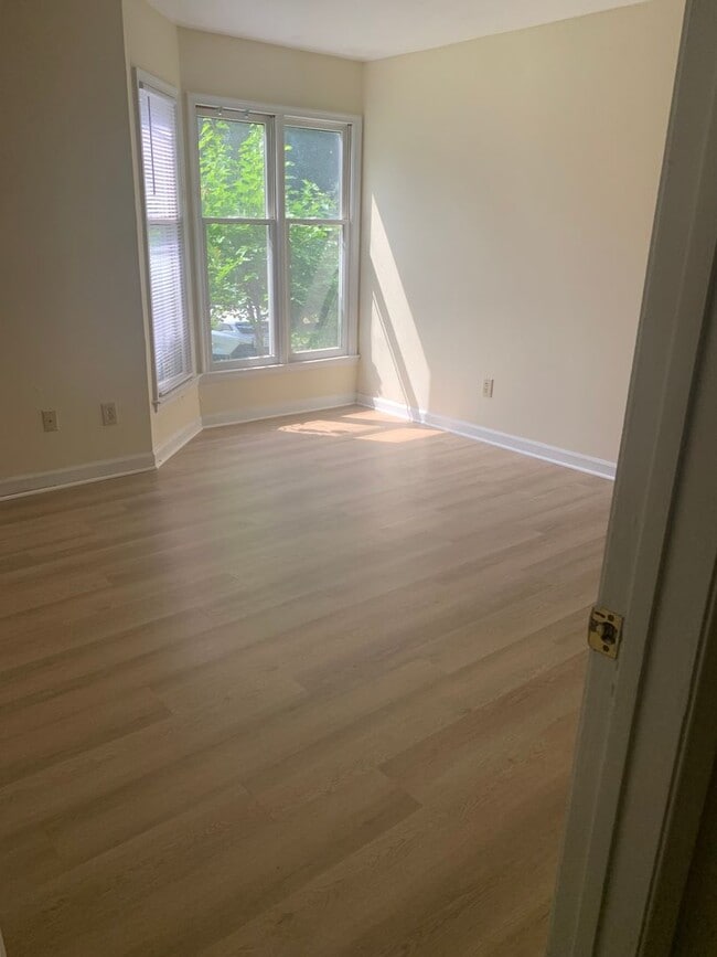 Building Photo - ONE LEVEL CONDO NEAR REX HOSPITAL -Firepla...