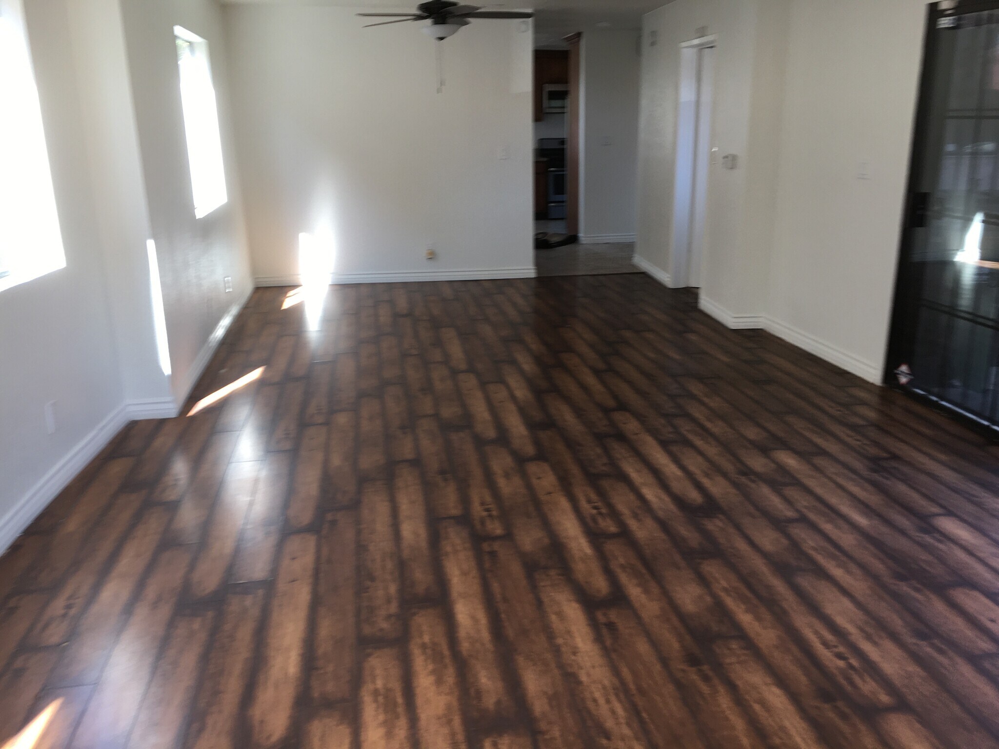 Separate dining area with brand new ceiling fan. - 806 E 65th St