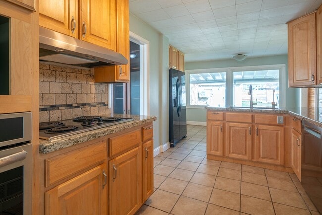 Building Photo - Beautiful Brick Home with Garden, Finished Basement & Detached Garage Office