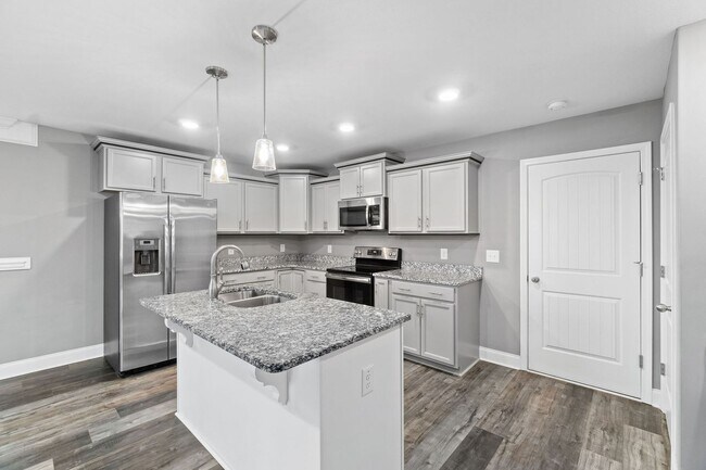 Building Photo - Pet Friendly Three Bedroom with Bonus!