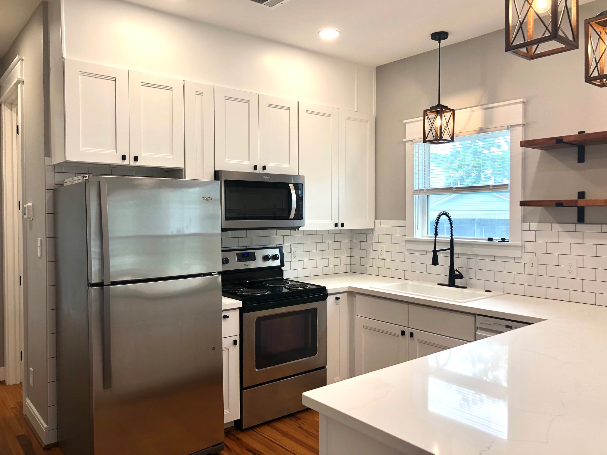 Quart counters with recessed dimmable lighting throughout entire apartment - 1004 Adele St