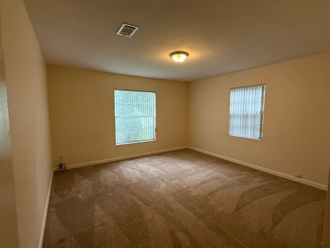 Building Photo - 4/2 Corner Lot Home with Fenced Yard