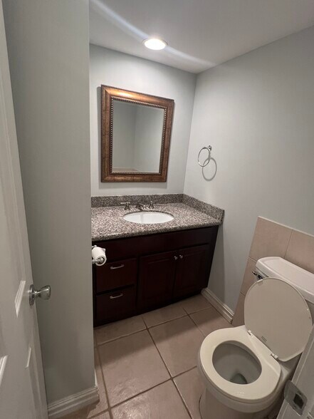 Downstairs half bath - 6803 Louisville St