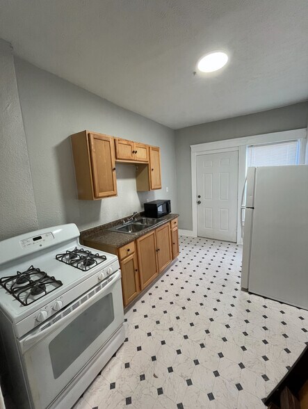 Kitchen; Stove and Fridge Included - 603 E 109th St