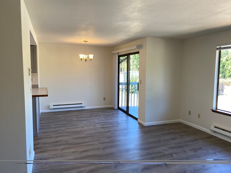 Luxury Vinyl Plank in the kitchen/living room for easy cleaning! - 5517 108th Avenue Ct E