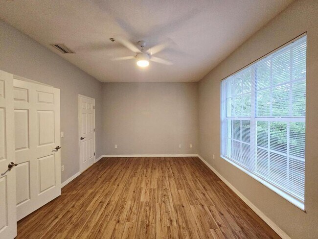 Building Photo - Annual 2/2 Condo with Flex Room in River Preserve Featuring Community Pool