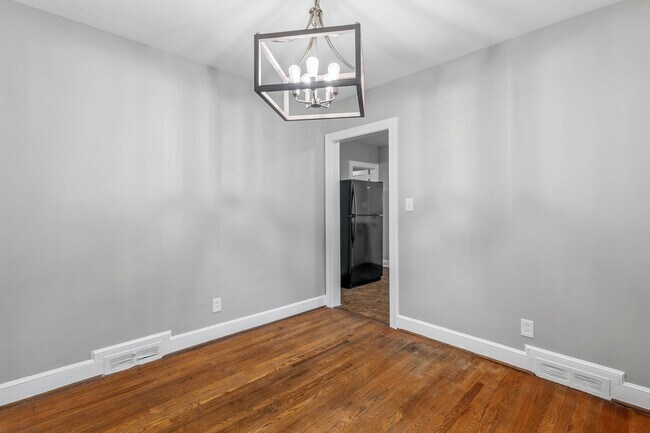 Building Photo - Brick home, Two Story, Hardwoods, DR, 2 Sun Rooms, FP, Carport!.