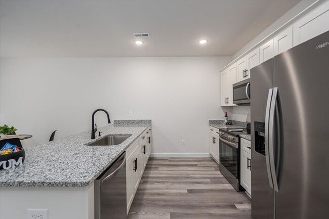 Building Photo - Brand-New Luxury Townhomes – First Month's...