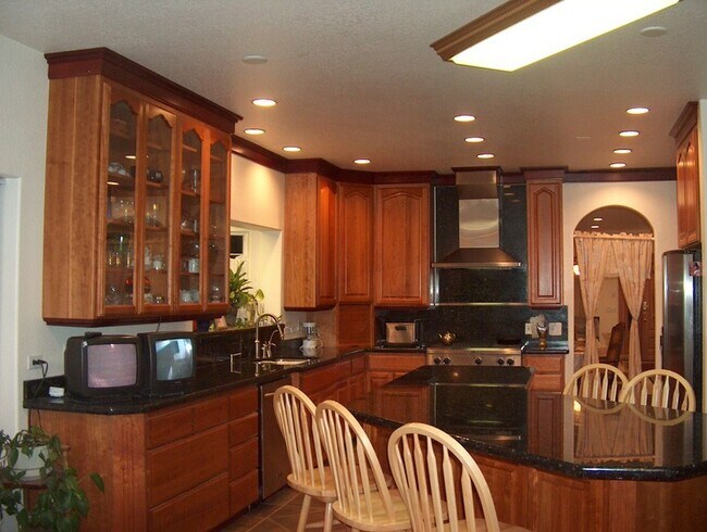 Building Photo - Centrally Located Custom Home each bedroom...