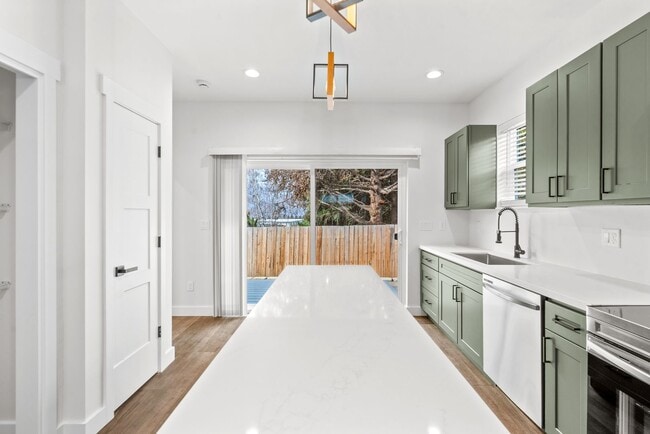 Building Photo - Brand new 2 bed/2 bath, central a/c, dishwasher, washer & dryer, deck & patio! March rent free!