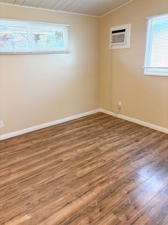 Building Photo - Gated Main House with Private Backyard & Bonus Room