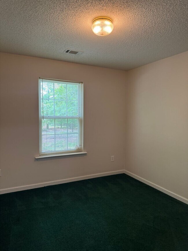 Building Photo - Spacious 4-Bedroom Home on Large Corner Lo...