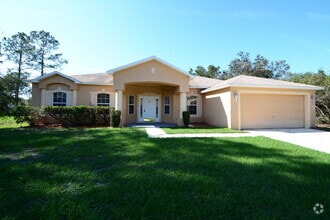 Building Photo - "Spacious 4-Bed Oasis in Palm Coast with 2...