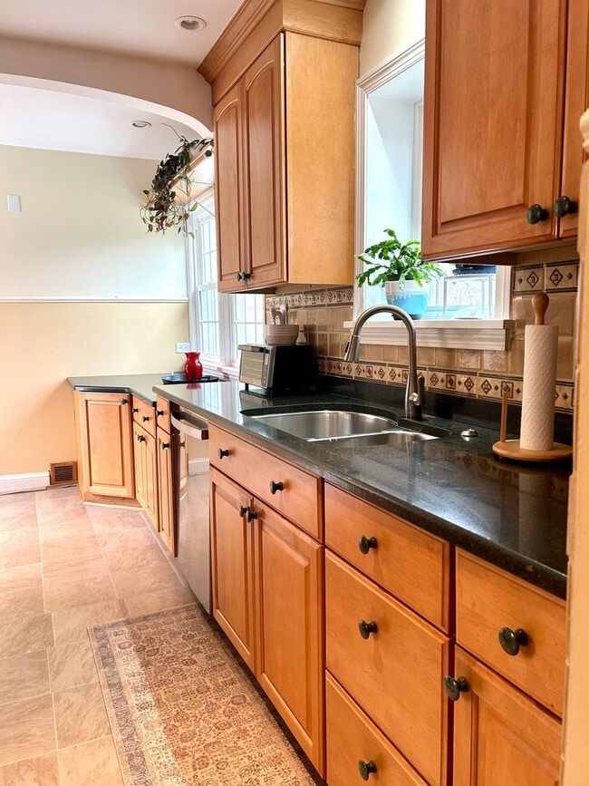 Building Photo - Sunroom Retreat | Fully Furnished 3BR with Private Fenced Yard