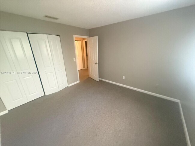 Building Photo - 10787 Royal Palm Blvd